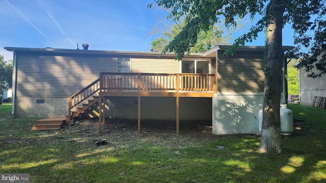 back of house with a yard and a deck