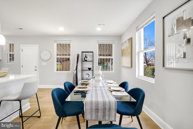 dining space featuring light hardwood / wood-style flooring