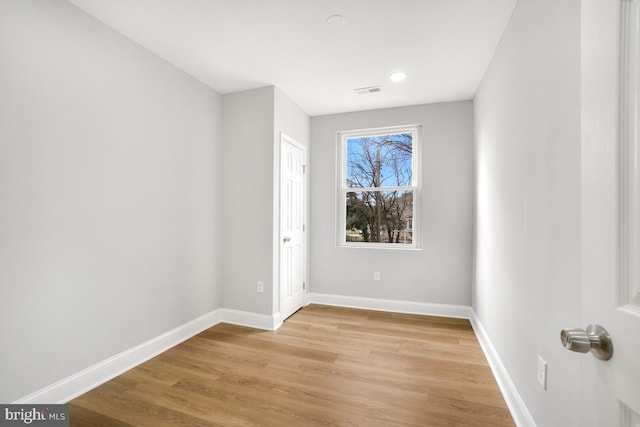 empty room with light wood-type flooring