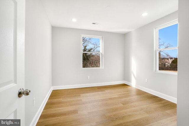 unfurnished room featuring light hardwood / wood-style flooring