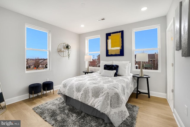 bedroom with light hardwood / wood-style flooring