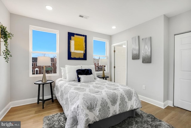 bedroom with hardwood / wood-style floors