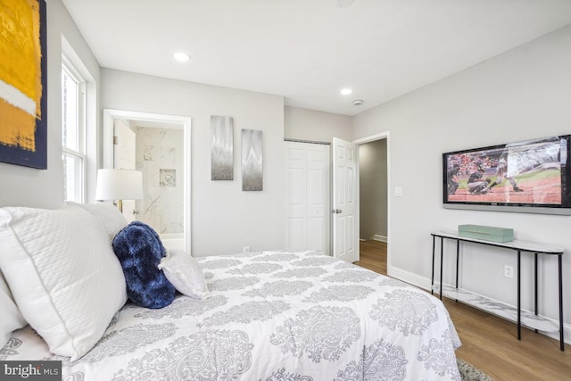 bedroom featuring hardwood / wood-style flooring and a closet