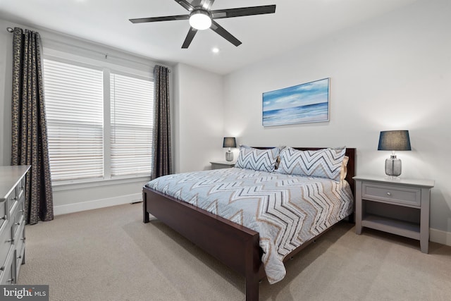 carpeted bedroom with ceiling fan