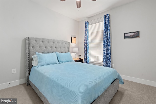 bedroom with ceiling fan and light colored carpet