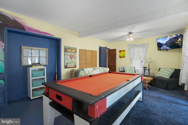 game room featuring ceiling fan, dark colored carpet, beamed ceiling, and billiards