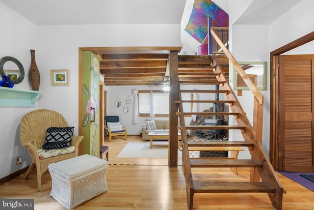 stairway featuring wood-type flooring