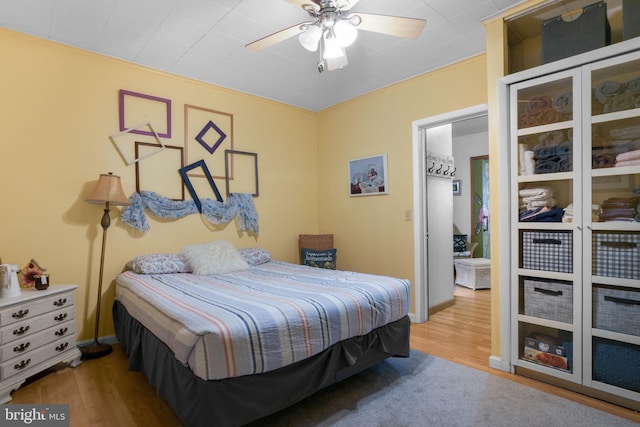 bedroom with hardwood / wood-style flooring and ceiling fan