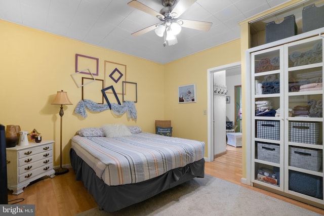 bedroom with hardwood / wood-style flooring and ceiling fan