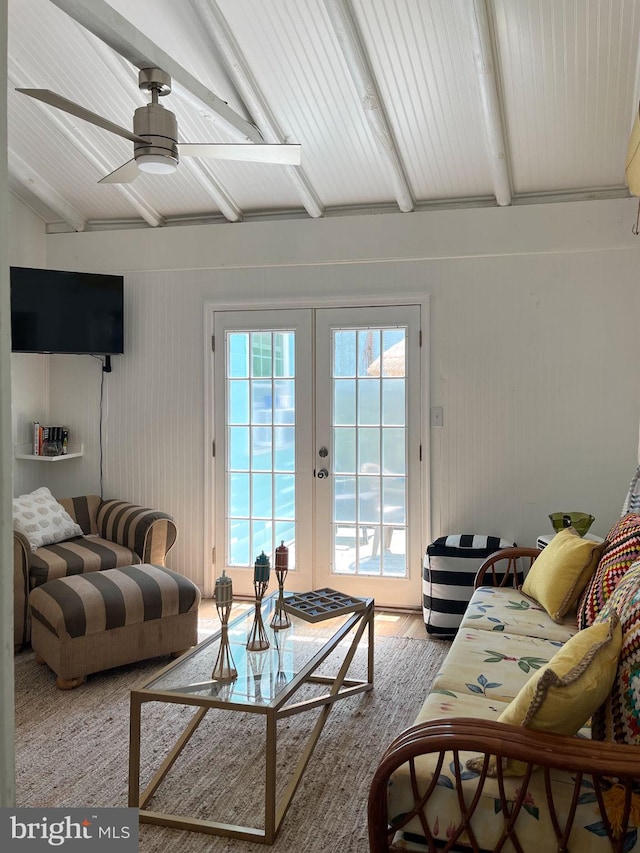 living room with french doors, hardwood / wood-style flooring, ceiling fan, and beam ceiling