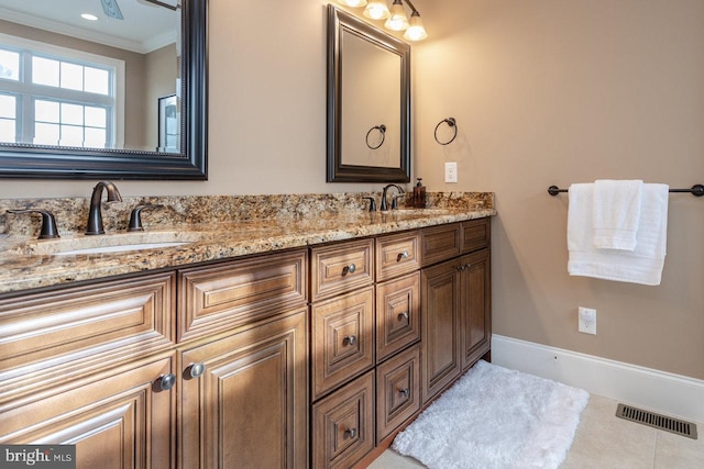 bathroom with vanity, tile patterned floors, and crown molding