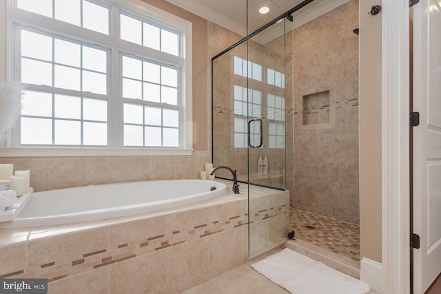 bathroom with tile patterned flooring, crown molding, and independent shower and bath