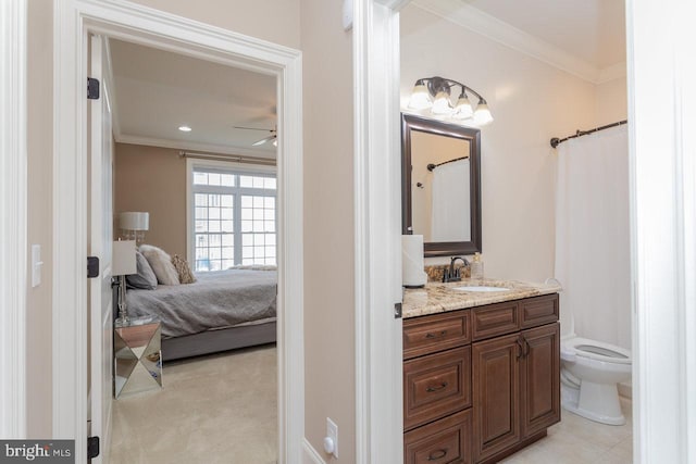 bathroom with a shower with shower curtain, ornamental molding, vanity, ceiling fan, and toilet