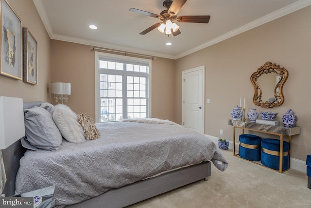 carpeted bedroom featuring ceiling fan and ornamental molding