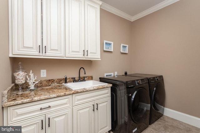 laundry area featuring sink, cabinets, independent washer and dryer, light tile patterned flooring, and ornamental molding