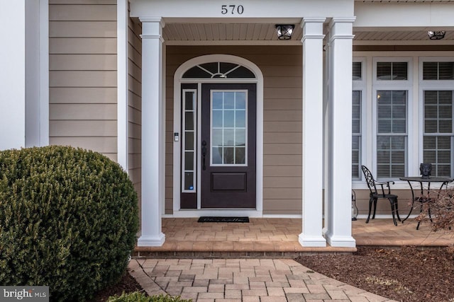 entrance to property with covered porch