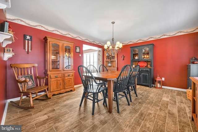 dining area with a notable chandelier