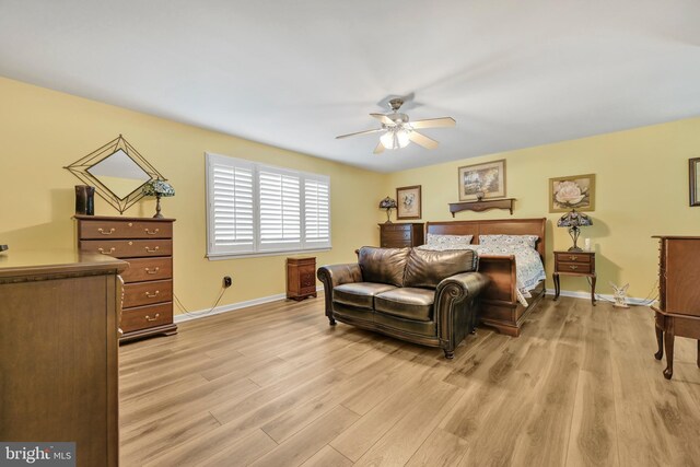 bedroom featuring light hardwood / wood-style flooring and ceiling fan