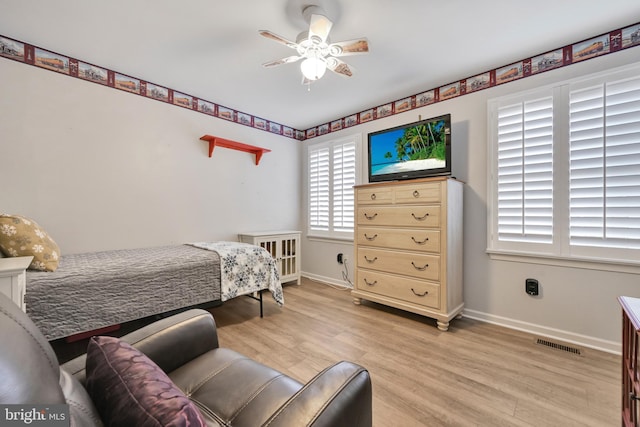 bedroom featuring light hardwood / wood-style floors and ceiling fan