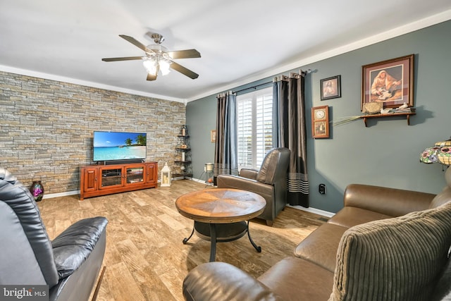 living room with ceiling fan, light hardwood / wood-style floors, and ornamental molding