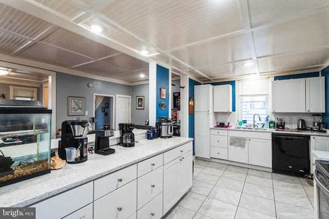 kitchen featuring white cabinetry, dishwasher, light stone countertops, sink, and decorative backsplash