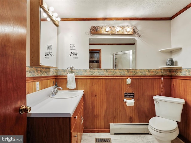 bathroom featuring walk in shower, vanity, baseboard heating, wooden walls, and toilet