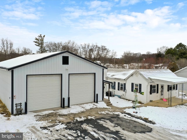 view of snow covered garage