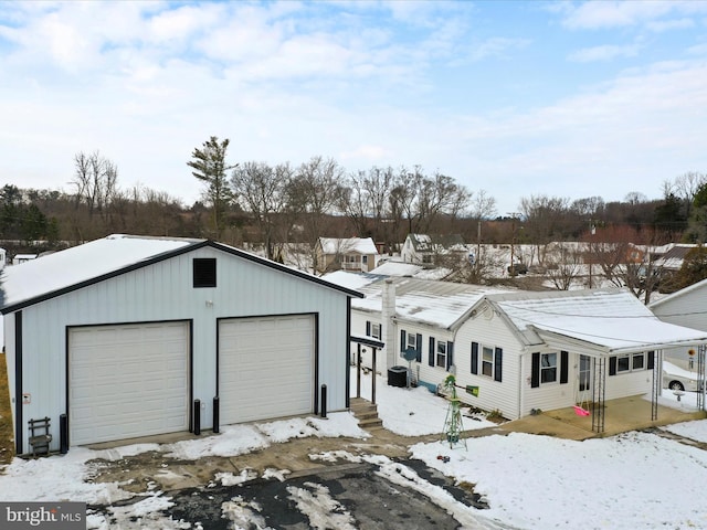 view of front of property featuring an outbuilding and a garage