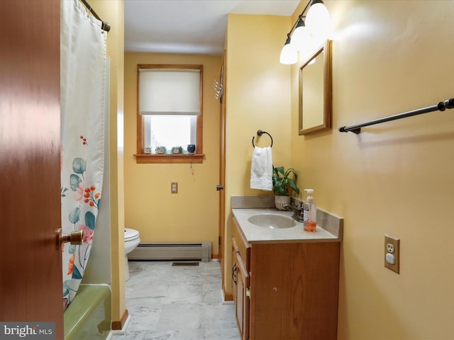 bathroom featuring vanity, toilet, and a baseboard heating unit