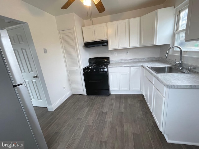 kitchen featuring sink, white cabinets, black range with gas stovetop, ceiling fan, and dark wood-type flooring