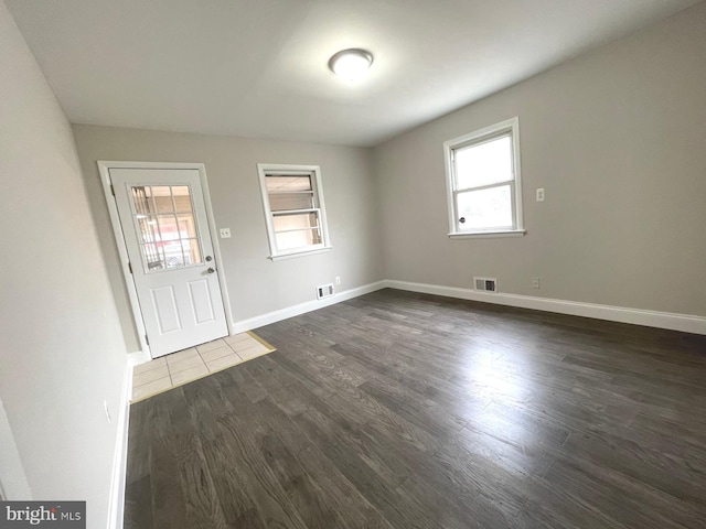 interior space with dark wood-type flooring