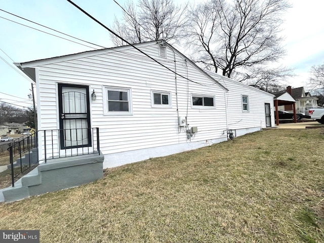 view of home's exterior with a lawn