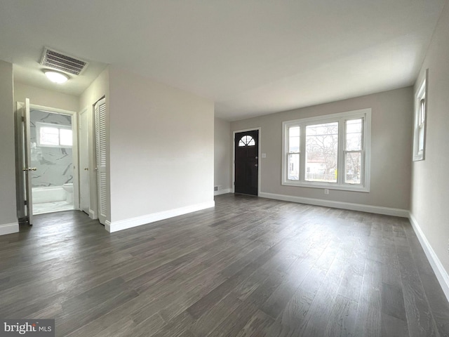 entryway with dark hardwood / wood-style floors