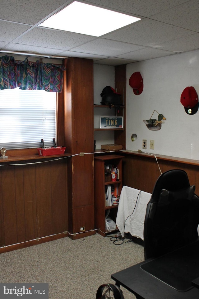 office space with a drop ceiling and carpet flooring