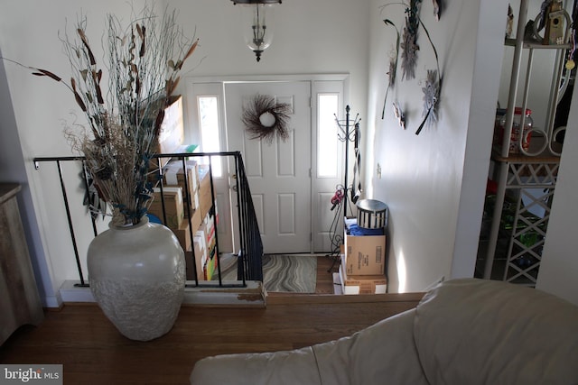 entryway with hardwood / wood-style flooring