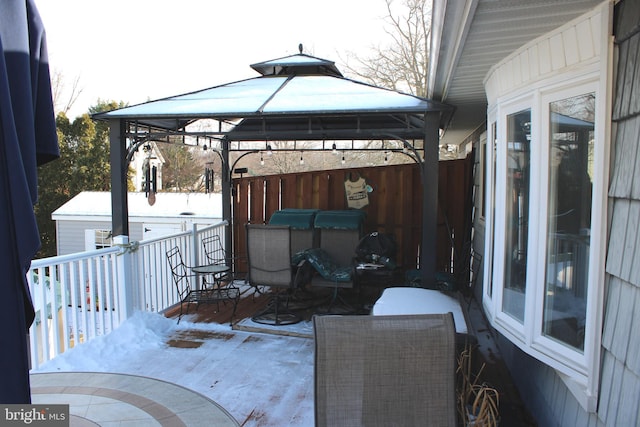 view of patio / terrace with a wooden deck and a gazebo