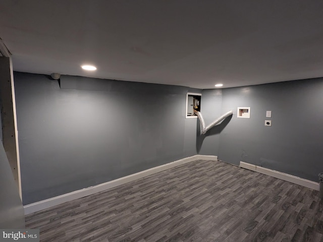 basement featuring dark hardwood / wood-style flooring