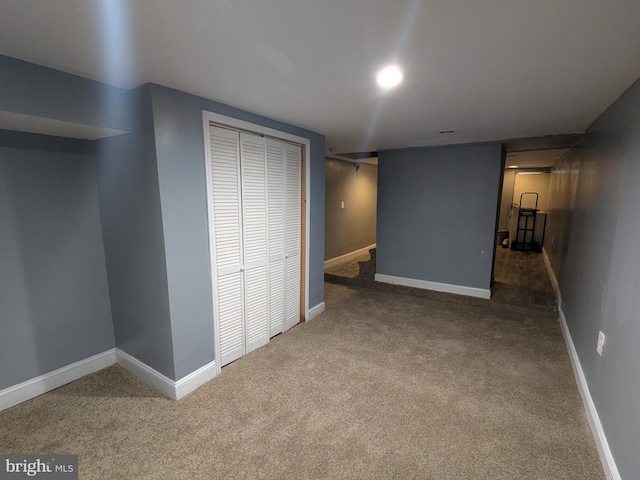 basement with dark carpet