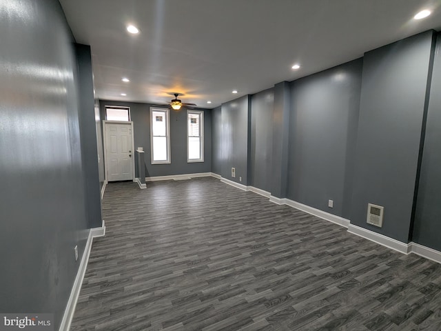 interior space with dark hardwood / wood-style floors and ceiling fan