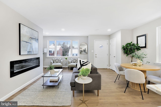 living room with light hardwood / wood-style floors