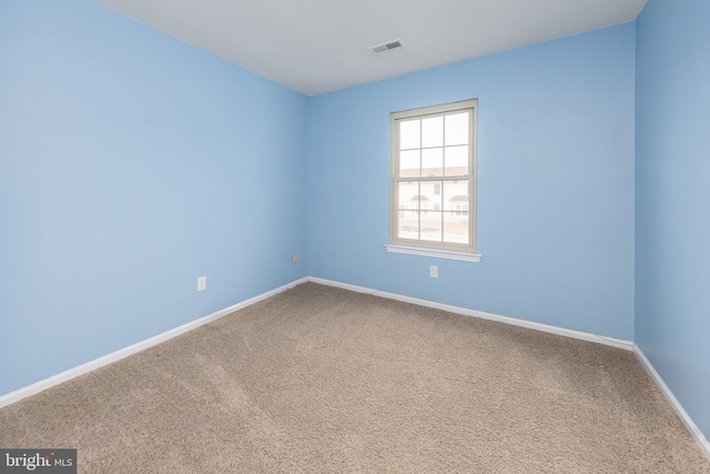 unfurnished room with carpet