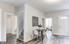 entryway with hardwood / wood-style flooring