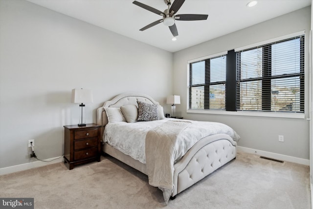 carpeted bedroom featuring ceiling fan