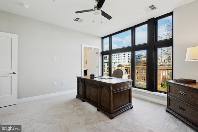 office with ceiling fan and light colored carpet