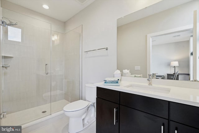 bathroom with walk in shower, tile patterned floors, vanity, and toilet