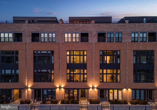 view of outdoor building at dusk