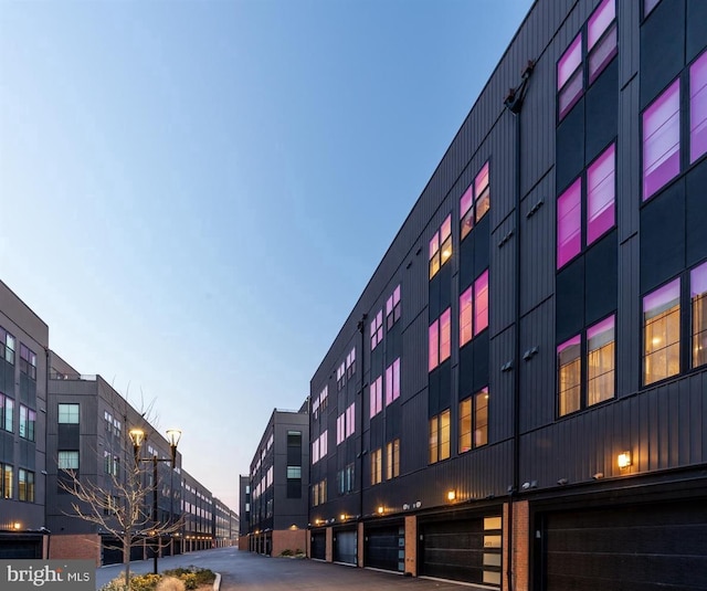 view of outdoor building at dusk