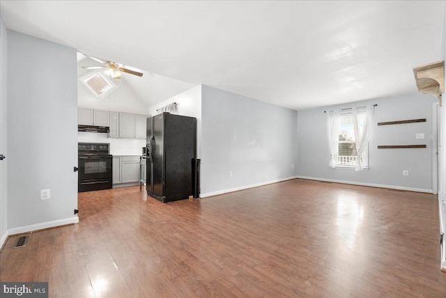 unfurnished living room with wood-type flooring, ceiling fan, and lofted ceiling