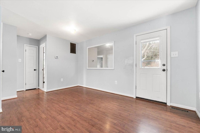 entryway with hardwood / wood-style flooring