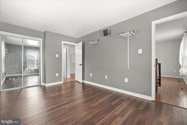 empty room featuring dark hardwood / wood-style floors